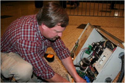 Ken Smith testing an escalator controller